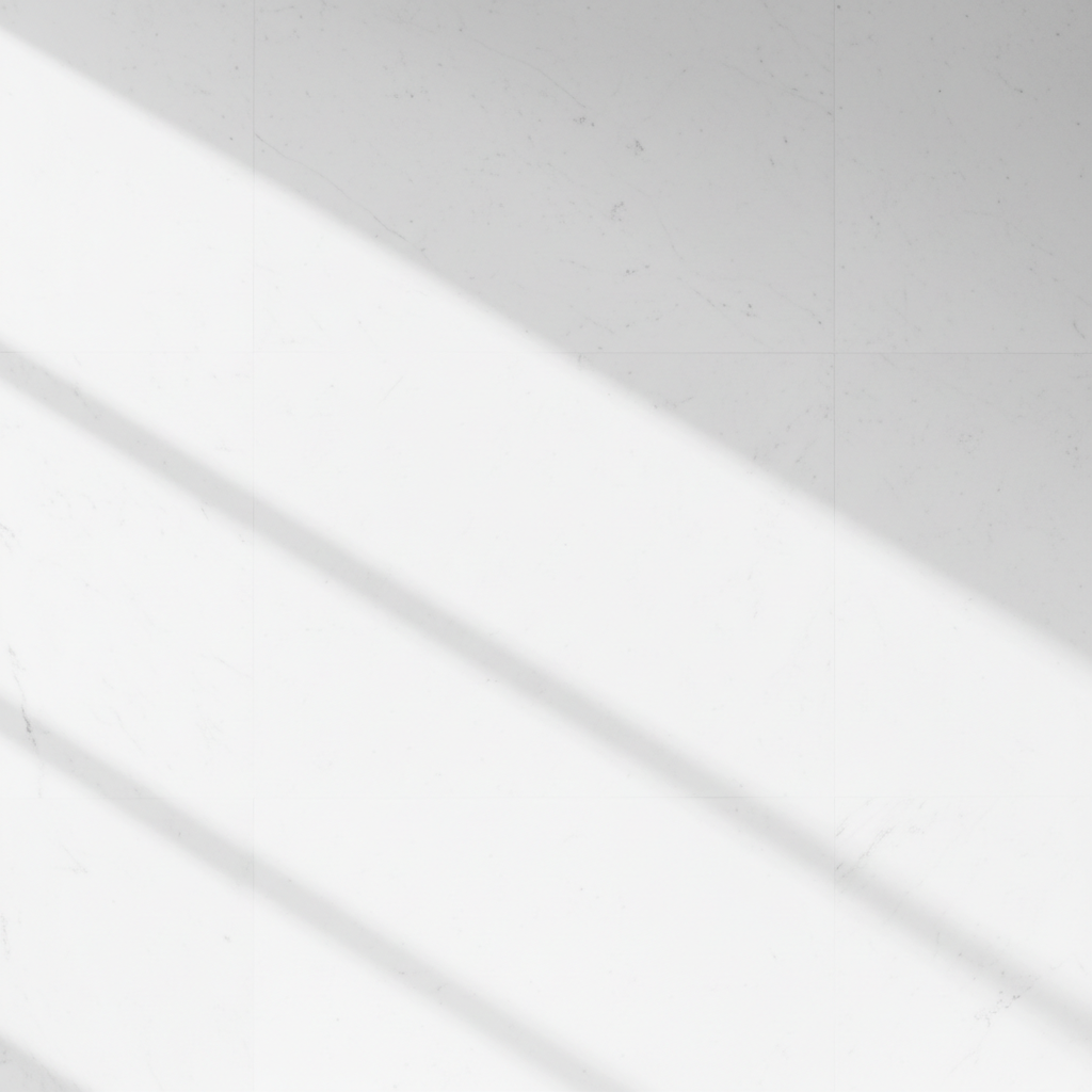 Minimalist white marble wall with soft shadows, high key photography