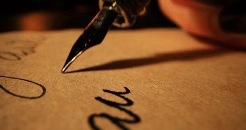 hand writing with a pen on paper, close up