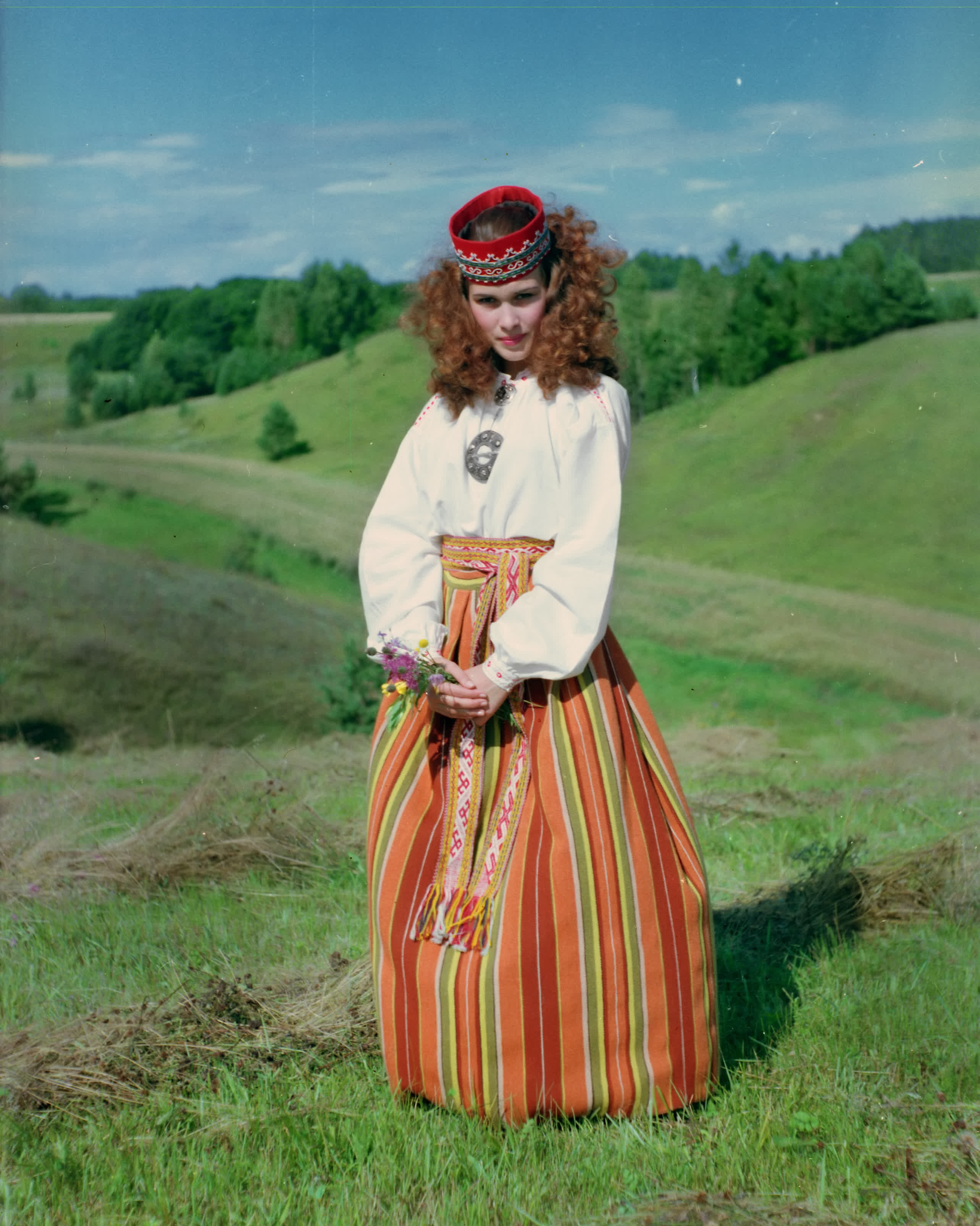 Woman in colorful striped skirt