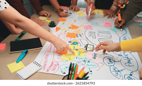 Close up photo of a diverse team brainstorming around a whiteboard, focus on sticky notes and engaged expressions, office environment, high resolution