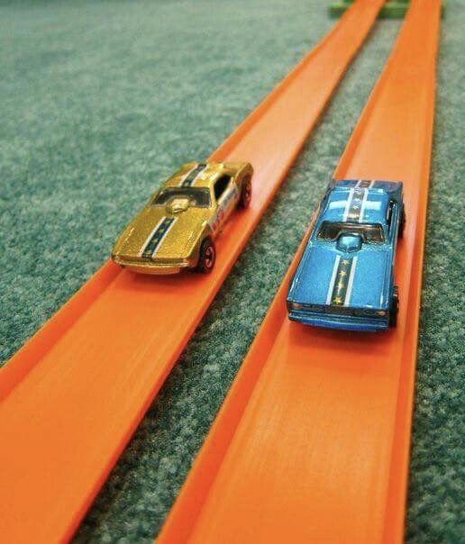 original 1968 Hot Wheels cars on orange track