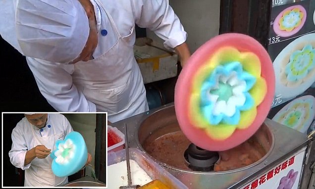 Chinese street food vendor making intricate spun sugar art shaped like a flower, close up
