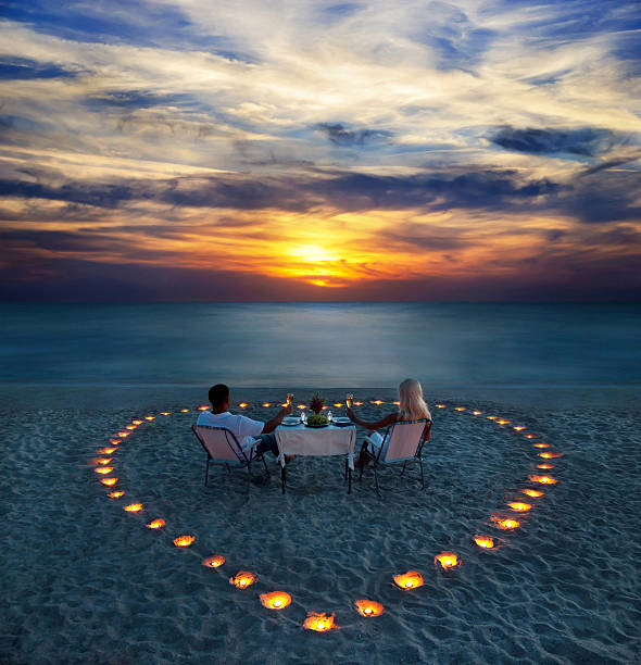 romantic couple dinner candlelight beach luxury