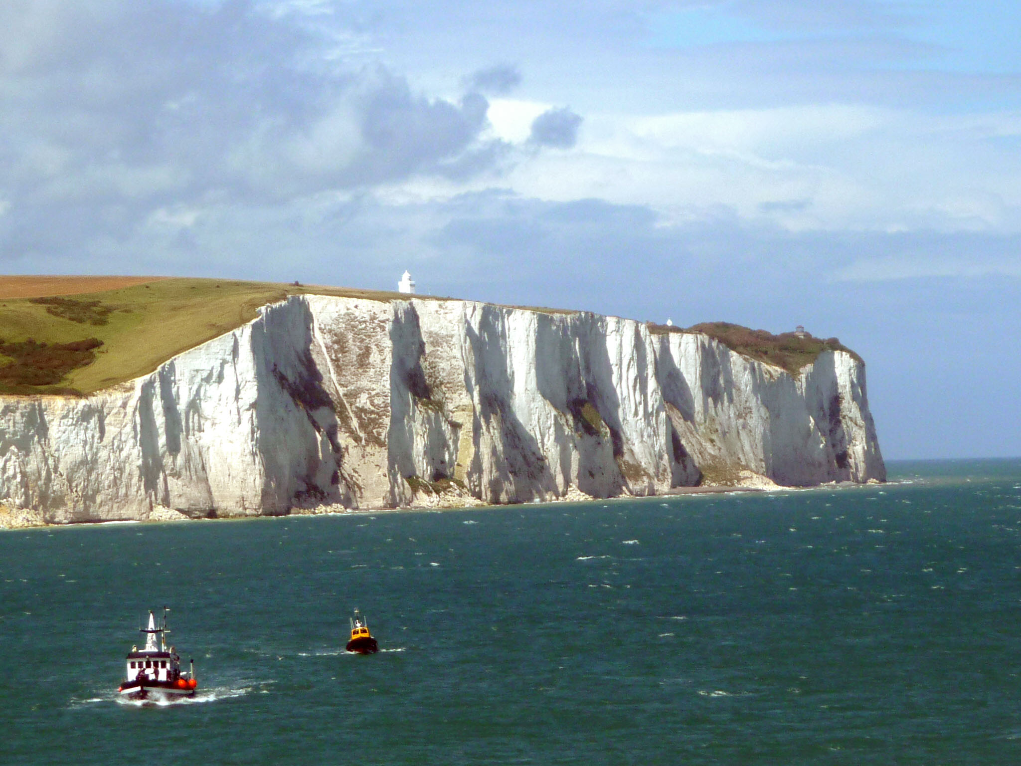 White chalk cliffs of Dover, grand landscape, sunny day, geological formation of calcium carbonate
