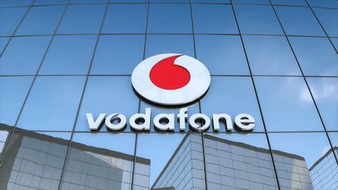 Vodafone logo on a modern glass building