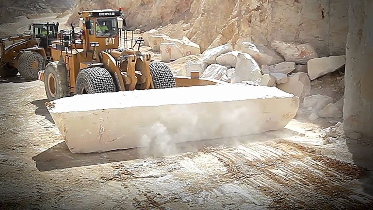 Levantina El Coto Crema Marfil quarry landscape, massive stepped marble excavation site in Spain, sunny day, wide angle