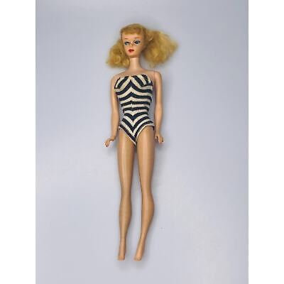 original 1959 Barbie doll in striped swimsuit