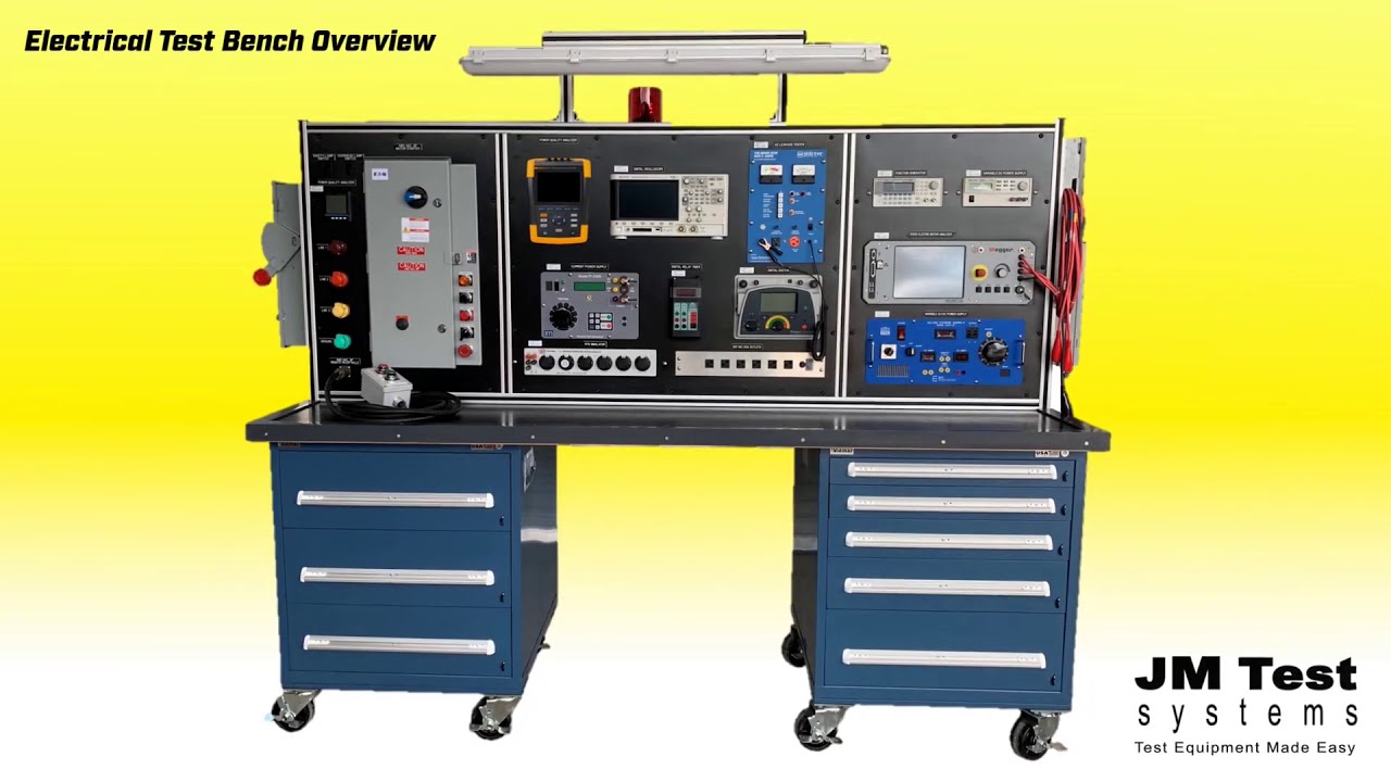 electrical engineering lab bench with DC motor dynamometer setup power supplies and multimeter