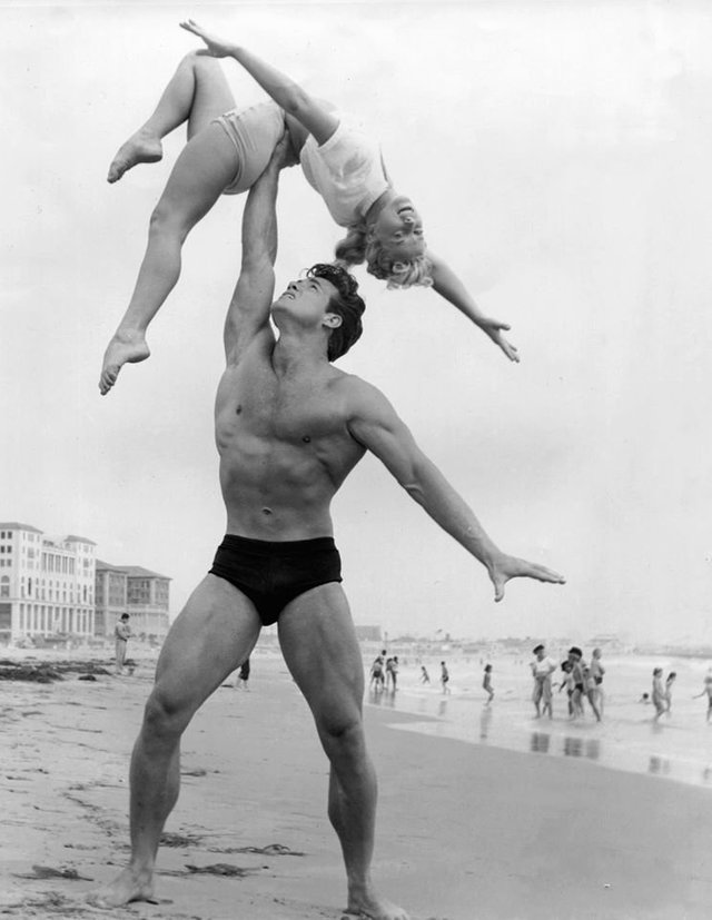 Steve Reeves posing beach black and white