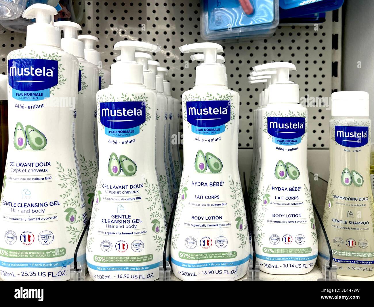 Mustela logo on a white modern cosmetic bottle packaging, close up, high quality product photography