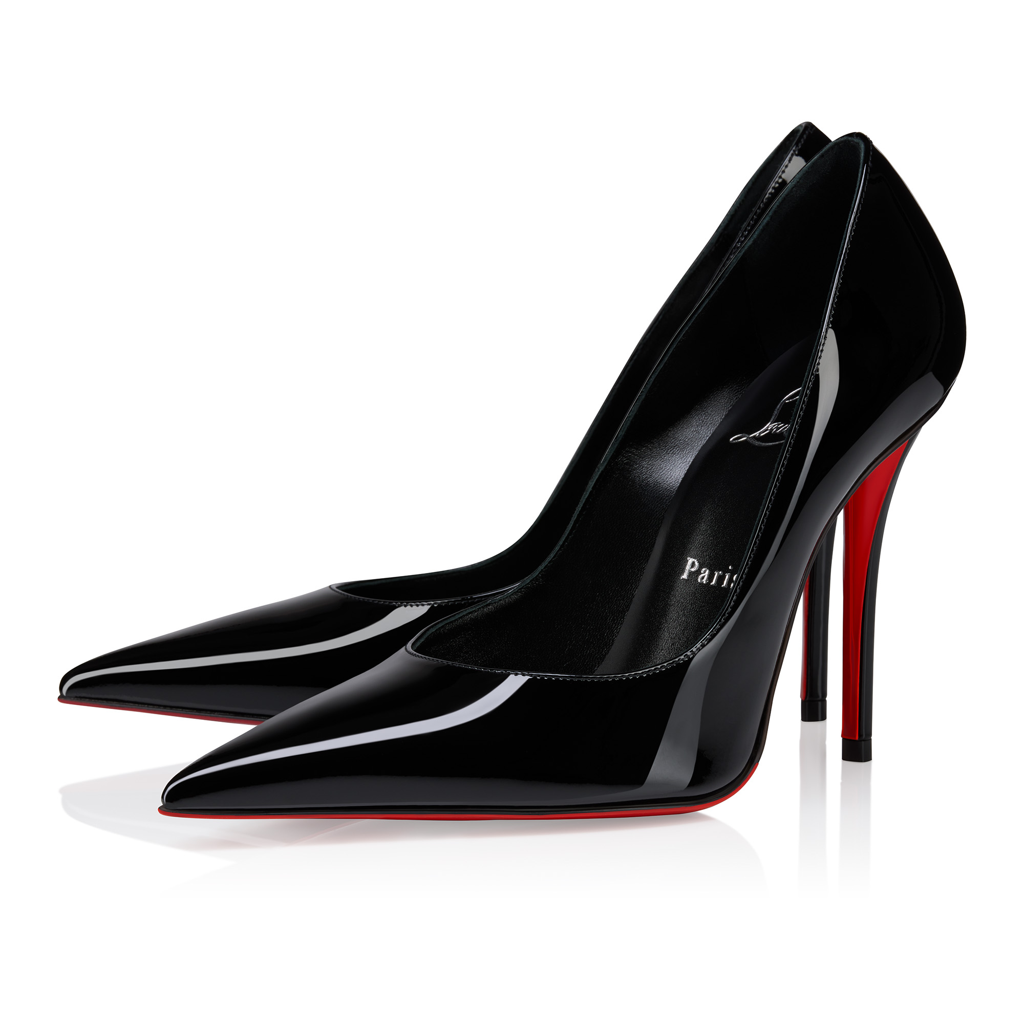 Christian Louboutin classic black pumps with red soles isolated on luxury background