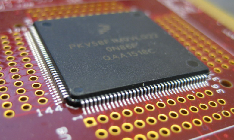 Close up photo of an ARM Cortex-M microcontroller on a circuit board, high quality macro photography