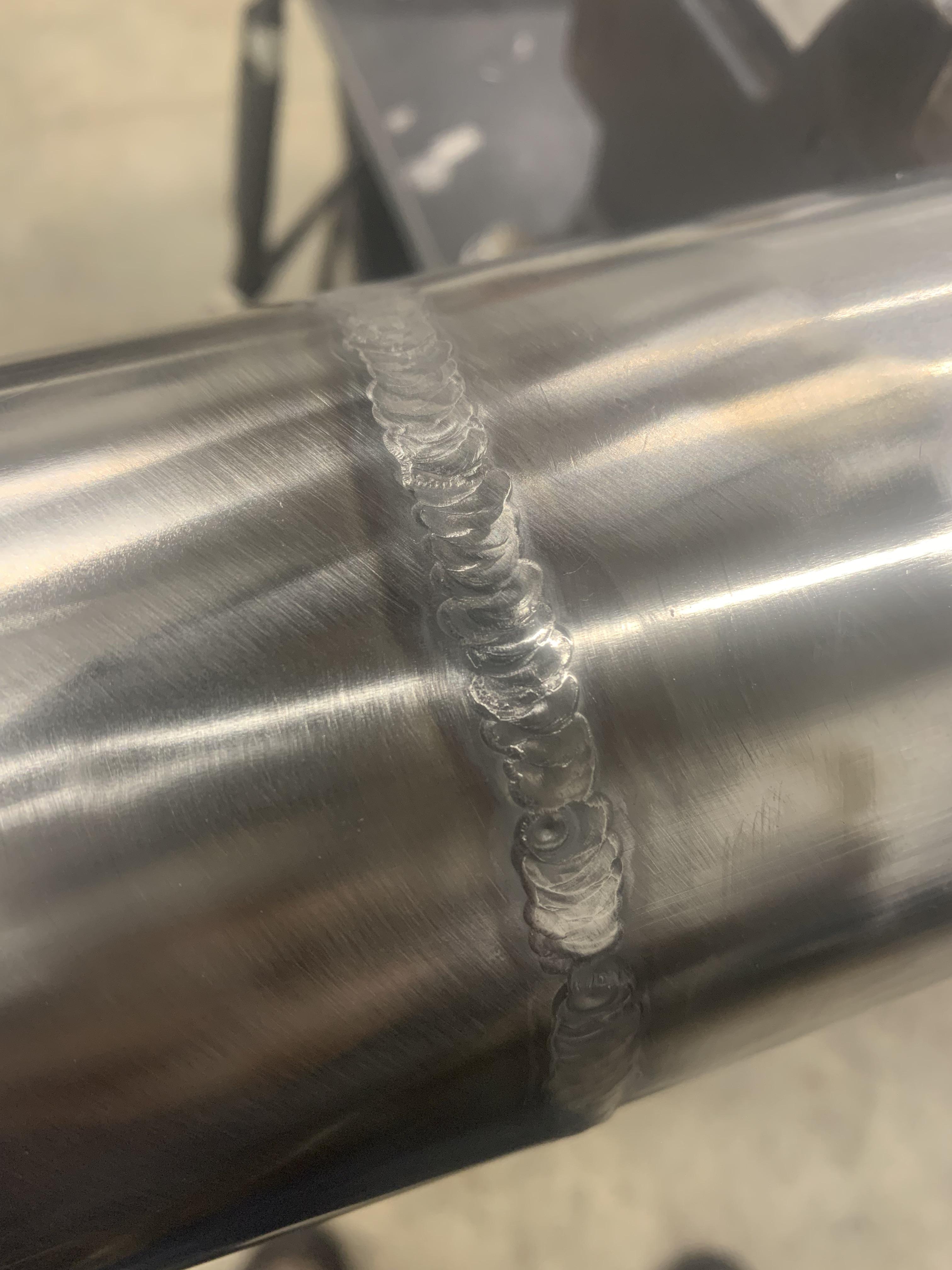 TIG welding stainless steel pipe close up
