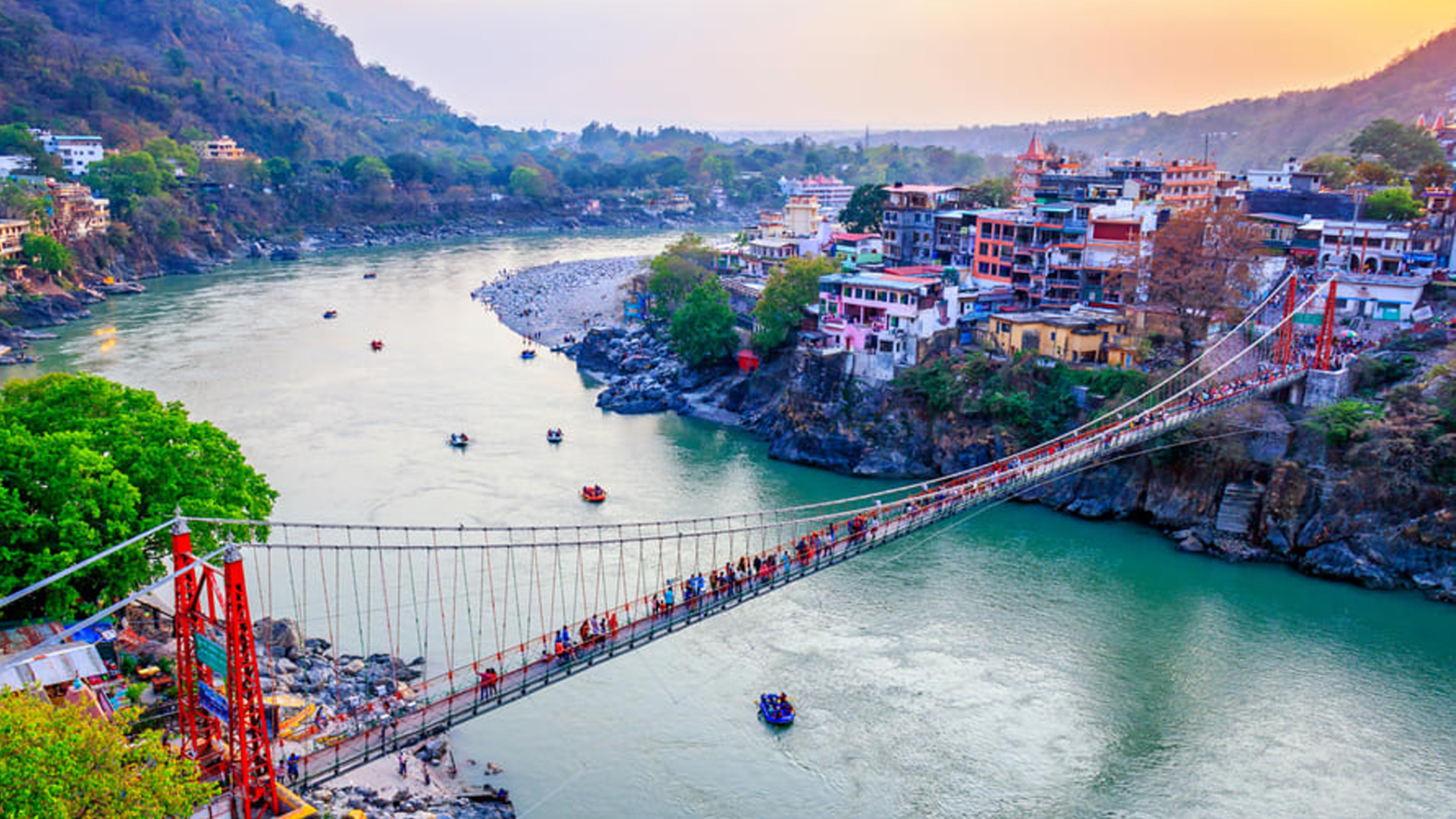 Rishikesh Uttarakhand suspension bridge Lakshman Jhula Ganges river tourists
