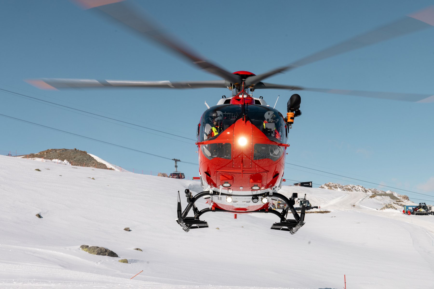 Rega Swiss air rescue helicopter landing in snow