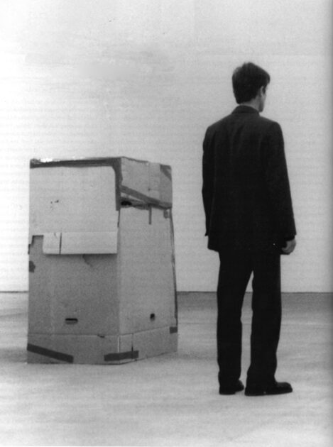 Santiago Sierra Person Paid to Remain Inside a Cardboard Box installation view