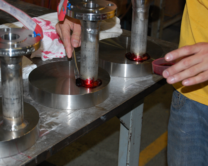 Dye penetrant inspection testing weld metal red dye white developer