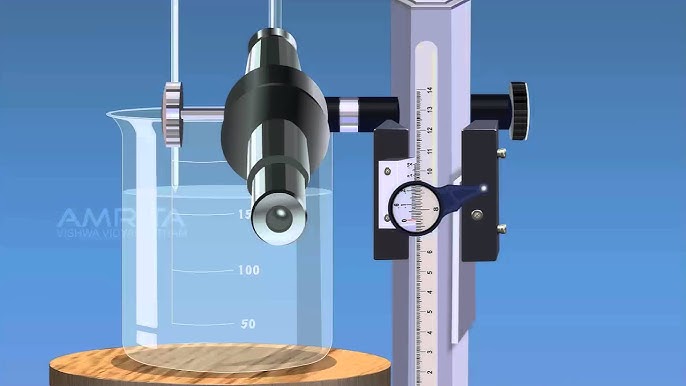 physics laboratory travel microscope setup with capillary tube and beaker
